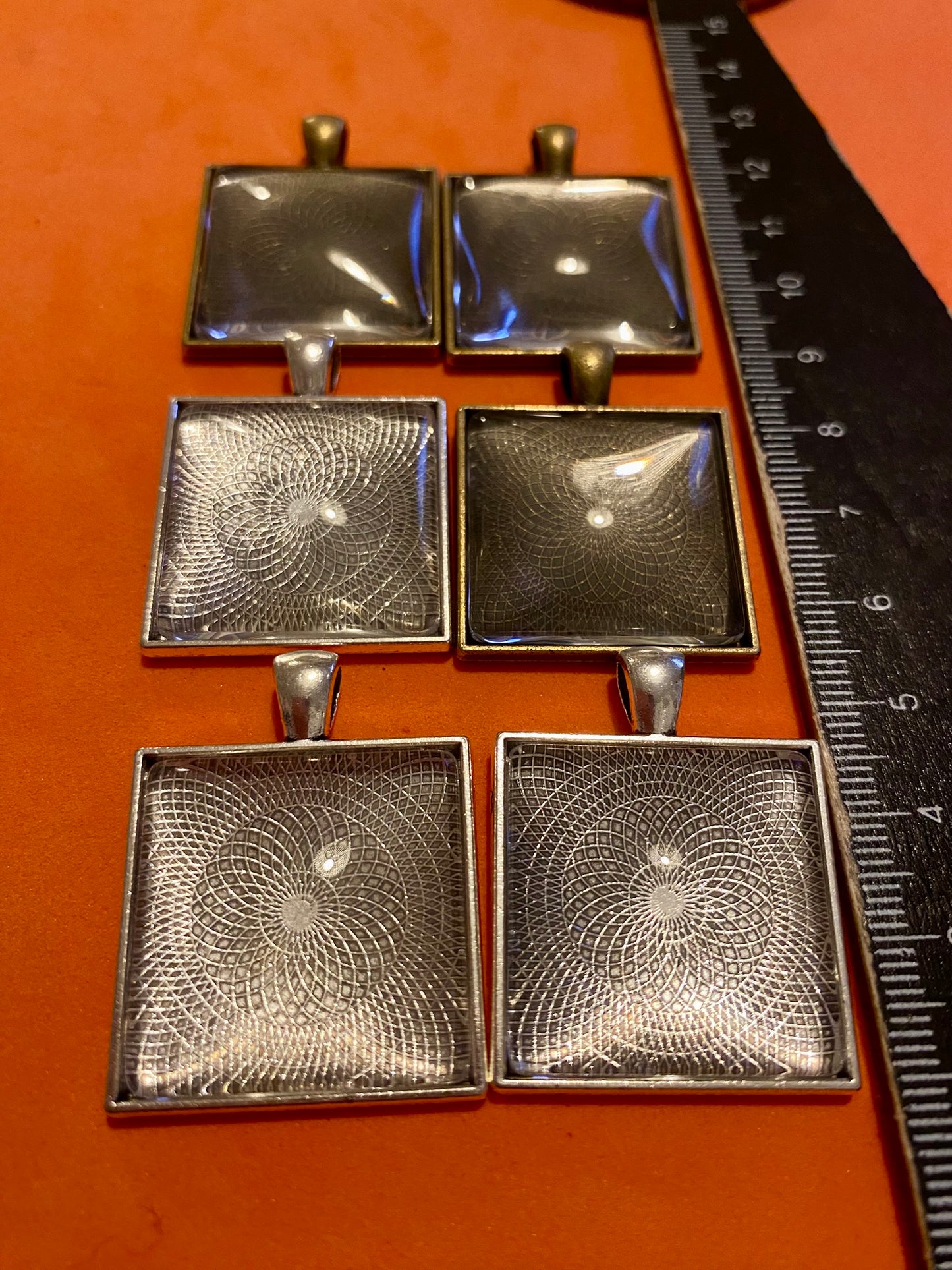 Six Square Silver and Bronze Pendants with Glass Doomed Cabachons