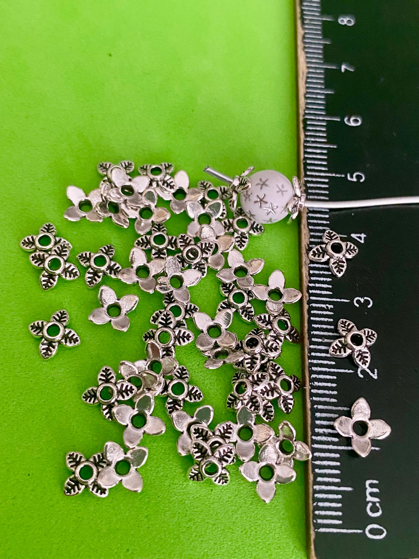 50 x Silver coloured petal shape spacer beads 6mm