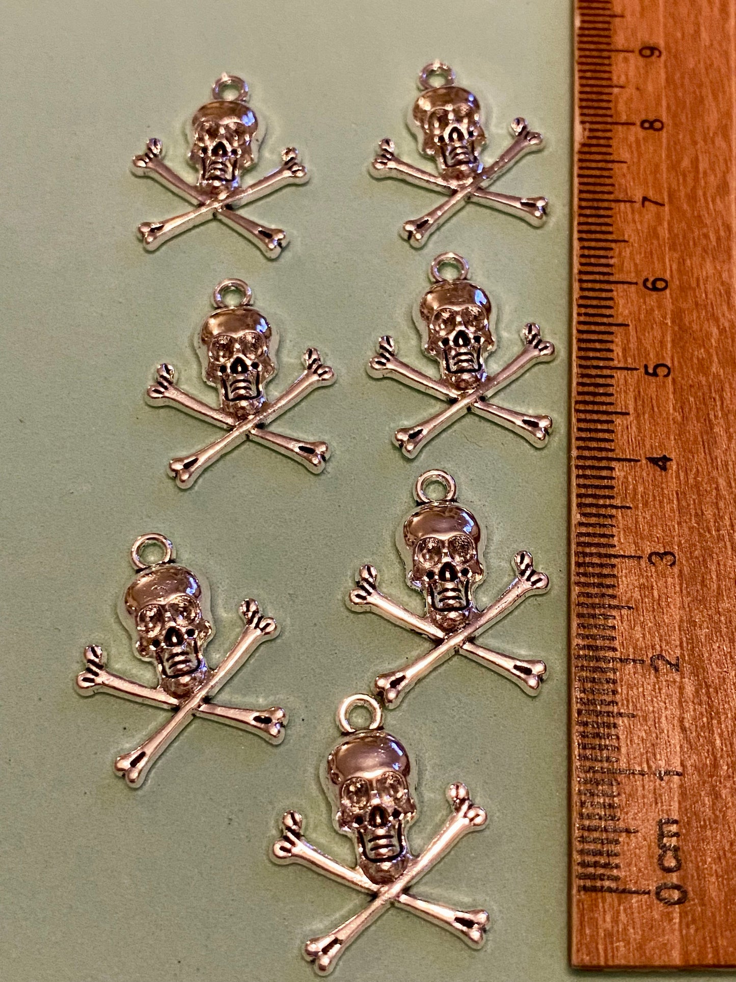 7 X Skull and Crossbones Charms 23mm