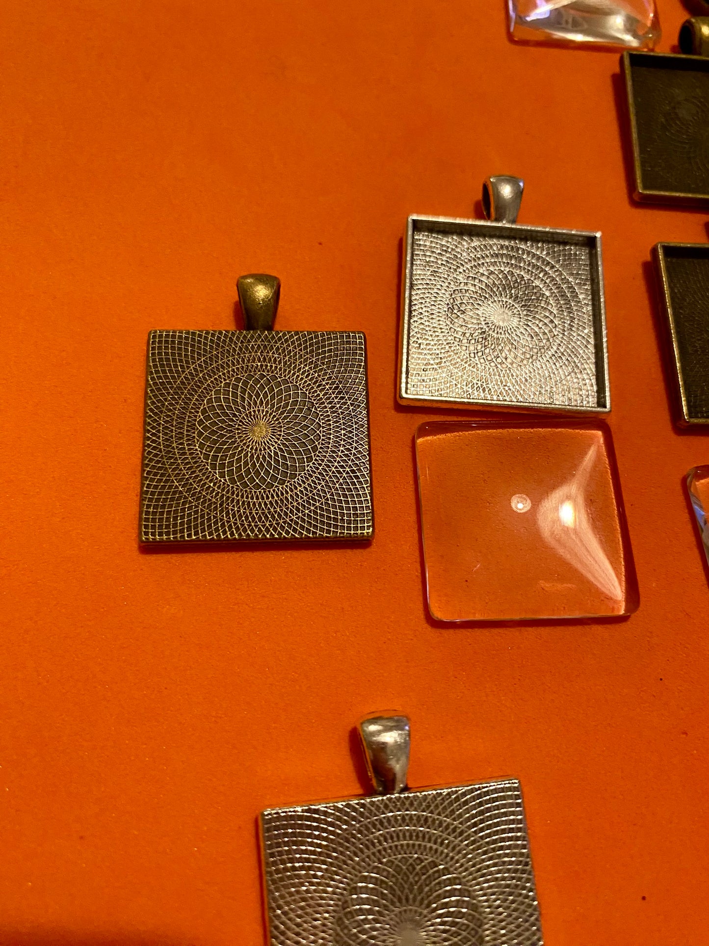 Six Square Silver and Bronze Pendants with Glass Doomed Cabachons