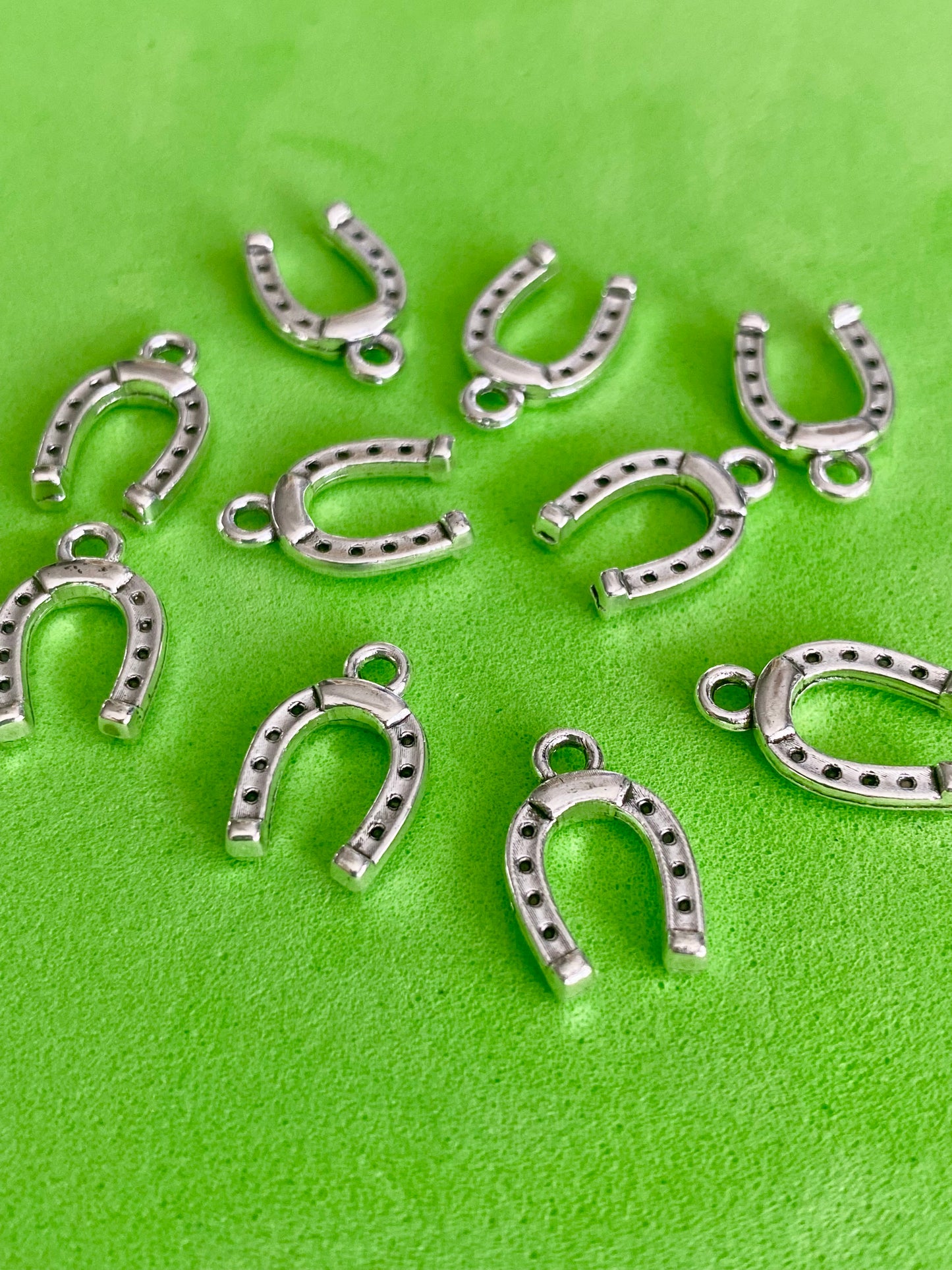 10 Silver Coloured Horse Shoe Charms 13mm