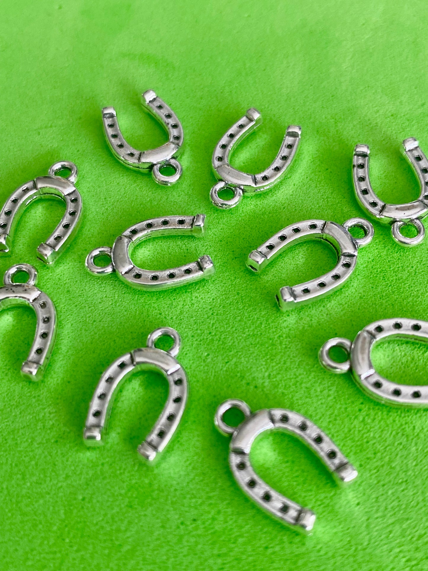 10 Silver Coloured Horse Shoe Charms 13mm